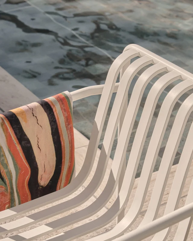 Sun skips across the water. A chair waits, draped in a moment to call your own. Sit, muse and catch the shimmer.